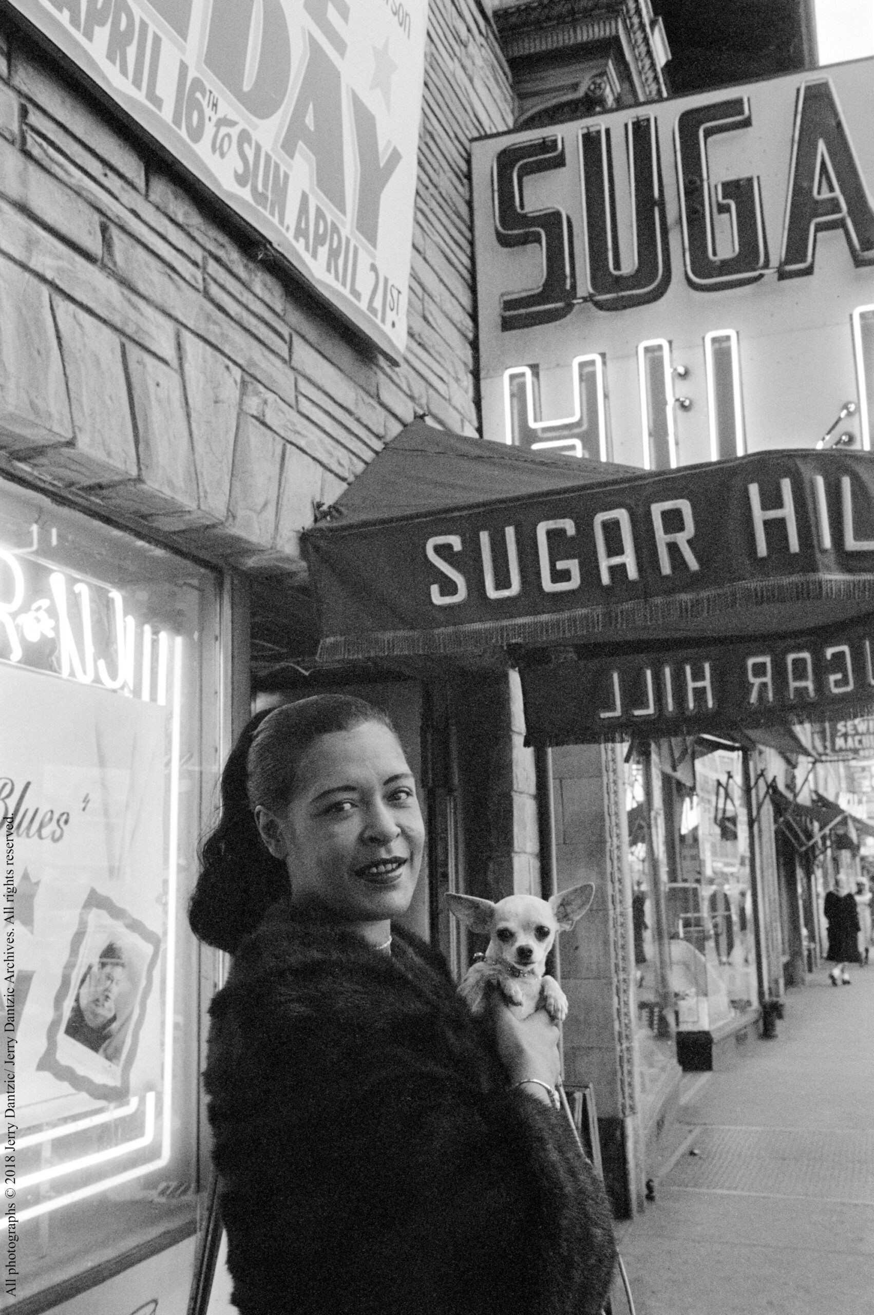 Billie Holiday holding her pet Chihuahua, Pepi, in front of Sugar Hill, Newark, New Jersey, April 18, 1957 All photographs © 2018 Jerry Dantzic/ Jerry Dantzic Archives. All rights reserved.